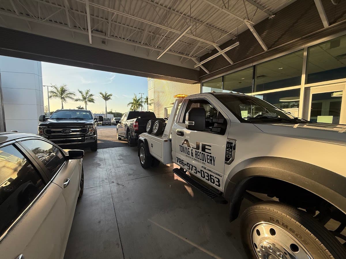 AJE Towing & Recovery wrecker on a dealership service call in South Florida